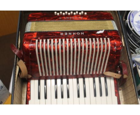 A HOHNER STUDENT II PIANO ACCORDION, in carry case
