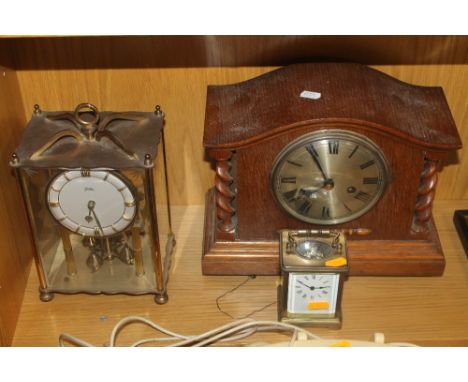AN OAK CASED MANTLE CLOCK TOGETHER WITH A SMALL CARRIAGE CLOCK AND ANOTHER 