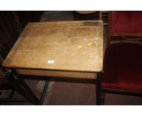 A VINTAGE CHILD'S WOODEN SCHOOL DESK