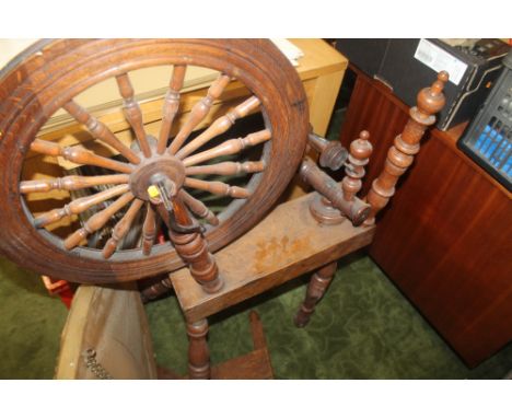 A VINTAGE TURNED WOOD SPINNING WHEEL