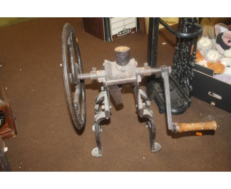 A 19TH CENTURY SHOP COUNTER COFFEE GRINDER, cast iron with large fly wheel