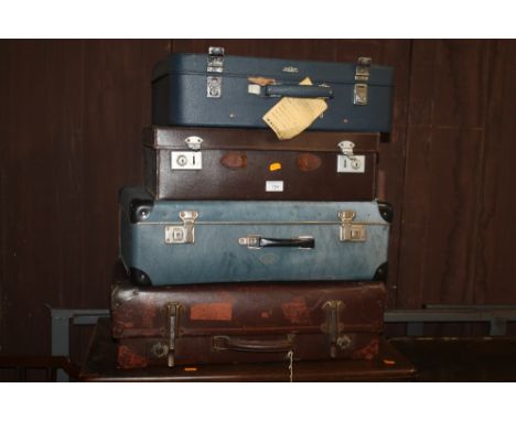 A OAK FIVE DRAWER CHEST TOGETHER WITH FOUR VINTAGE SUITCASES