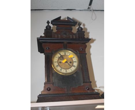 AN OAK MANTLE CLOCK 