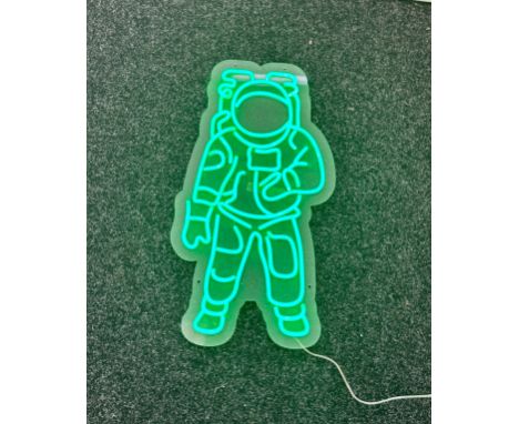 Neon beach light up "astronaut" green neon light, complete working order measures approximately 22 inches by 10.5 inches 