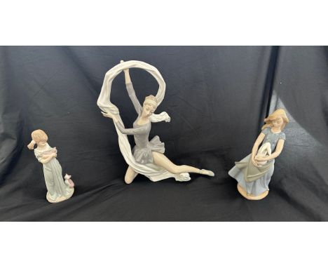 Lladro girl and cat figure along with 2 nao figures includes ballerina and girl with bunny 