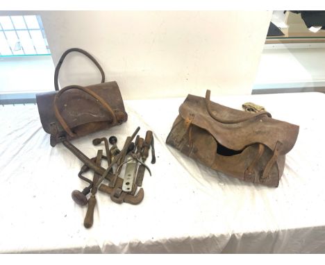 Two vintage West midlands gas leather bags with tools to include hammers, files etc 