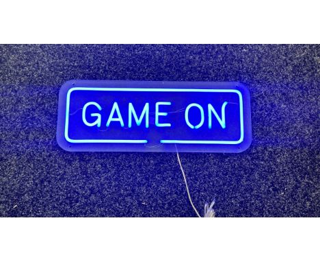 Neon beach light up game on blue neon light, complete working order measures approximately 20 inches by 7.5 inches 
