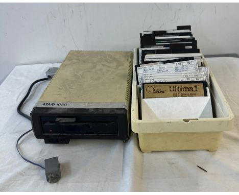 Vintage Atari 1050s console, untested and a large selection of Atari games includes Ultima1, dragon eye, Wargame, Micro paint