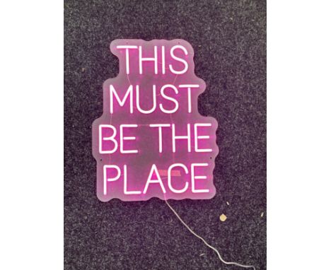 Neon beach light up "this must be the place" pink neon light, complete working order measures approximately 20 inches by 15 i