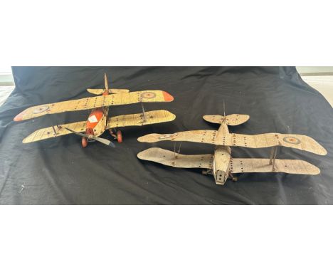 Two tin model planes largest measures 18 inches wide by 16 inches long 