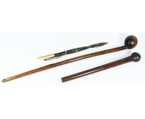 Zulu hardwood Knobkerrie the end carved with two dimples, L68cm, an African fishing spear end, the shaped metal point with mu