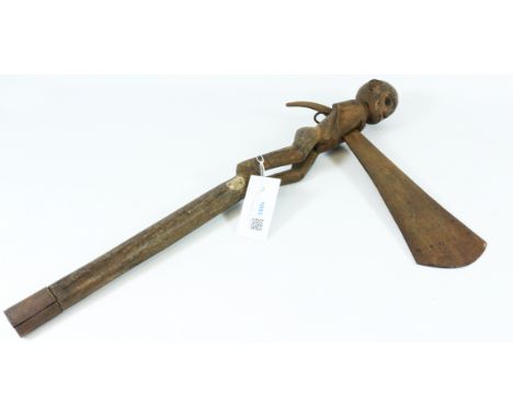Unusual Zulu axe, the shaped iron blade inlaid with roundels supported through the carved wooden body of a man H56cm   Condit