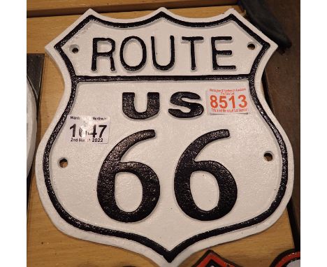 Cast iron Route 66 sign, 22 x 25 cm. P&amp;P Group 2 (£18+VAT for the first lot and £3+VAT for subsequent lots) 