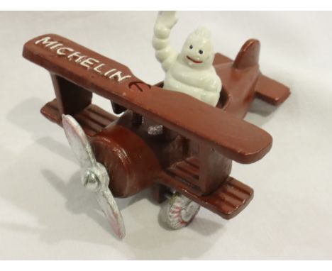 Cast iron Michelle man in plane. P&amp;P Group 1 (£14+VAT for the first lot and £1+VAT for subsequent lots) 