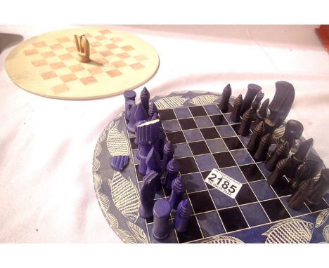 Two soapstone circular chess boards, soapstone chess set in be and black, some damage to pieces. P&amp;P Group 3 (£25+VAT for