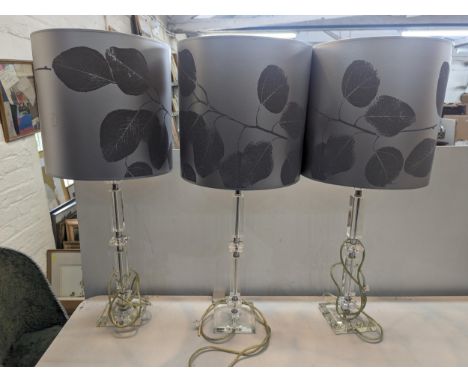 Three table lamps having Perspex bases and Liberty's lamp shades, Location: 