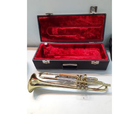 An American Blessing Scholastic gold tone trumpet in fitted case together with a Thos Flaxton Ltd Class A silver tone cornet 