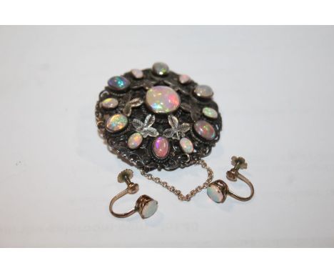 Opal and white metal brooch with floral decoration togwther with a pair of yellow metal and opal earrings (3)