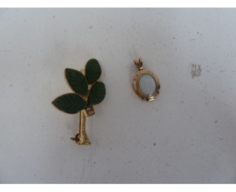 An opal pendant with a 1960's gold leaf brooch