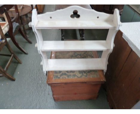 An Edwardian mahogany commode with fabric top with a white painted hanging triple shelf with carved trefoil 58cmW