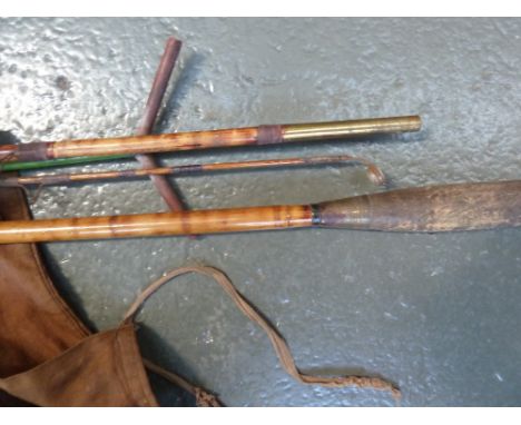 A nineteenth century three piece bamboo fishing rod, bag and vintage rod rest