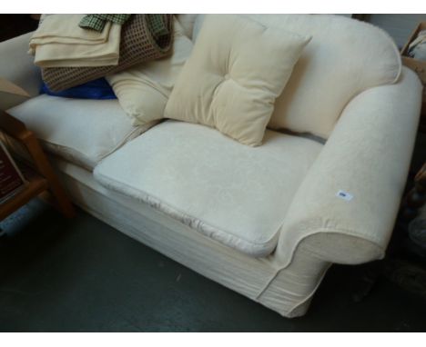 A 20th century white floral upholstered two seater sofa