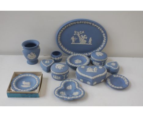 A collection of Wedgwood jasperware including various trinket dishes and covers, a small urn and various small plates, with a