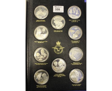 Album of Royal Air Force Museum silver proof medallion coins, detailing the first men to fly, the first crossing of sea by ai