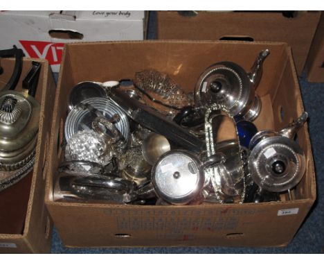 Box of assorted metalware to include cased butter knives, silver plated tea service, toast rack, brass goblets, serving trays