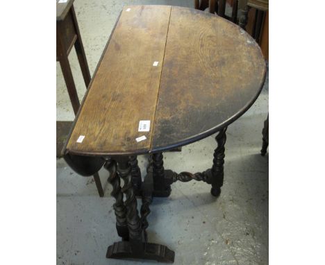 Early 20th Century barley twist gate legged table. CONDITION REPORT: Fully extended 32½" diameter, 27½" high.