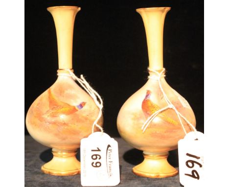 Pair of Royal Worcester porcelain baluster vases hand painted with pheasant decoration.  Green printed marks to base.  shape 