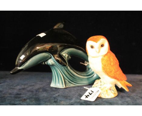 Poole pottery study of a dolphin, together with Beswick study of an owl.  Impressed marks and number 2026.  (2)