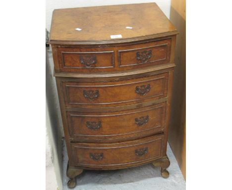 Reproduction walnut bow front, small chest of drawers on cabriole legs.