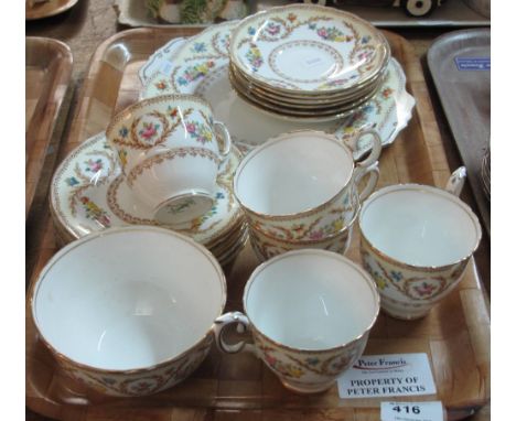 Tray of Crown Staffordshire fine bone china tea ware items on a white ground with gilt and floral decoration comprising tea c