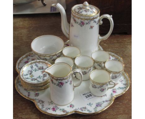 Aynsley fine bone china cabaret set on a white ground with a gilt and floral decoration comprising six coffee cans and saucer