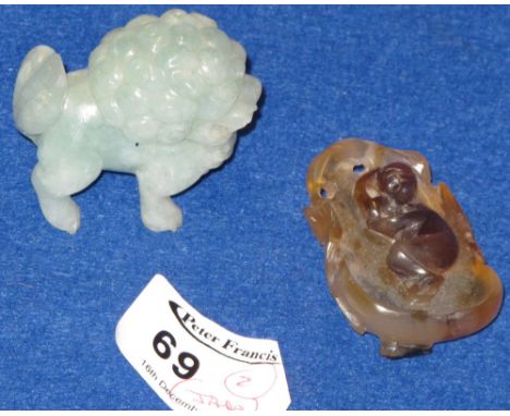 Small Chinese bi coloured jade study of a sleeping child on lotus leaf with insect detail, together with a hard stone carving