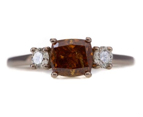 FANCY YELLOWISH ORANGE DIAMOND THREE STONE RING,set with a central fancy coloured cushion cut diamond of approximately 1.04 c