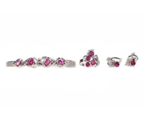 RUBY AND DIAMOND SUITE,comprising necklet, bracelet, ring and earrings, each set with oval rubies and round brilliant cut dia