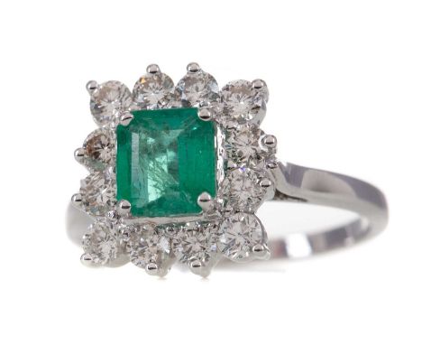 EMERALD AND DIAMOND RING,the step cut emerald of approximately 1.11 carats, within a halo of round brilliant cut diamonds tot