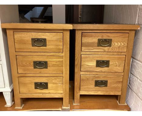 Pair of light oak three drawer bedside chests, 42cm wide, 35cm deep, 58.5cm high