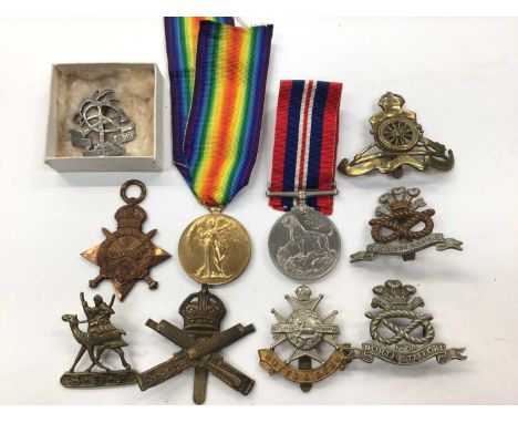 First and Second World War medals, together with various military badges