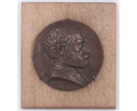 19th century Continental oval portrait relief metal plaque of a gentleman, indistinctly signed and dated 1885, 20cm diameter,