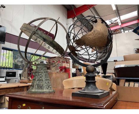 Two metal garden globe sundialsThe freestanding one measuring 69cm in length (arrow through the middle). The one on its side 