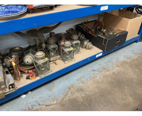 Large collection of brass and copper ware, including carriage lamps ship's lamps, a bugle, etc