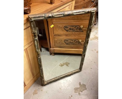 Bevelled wall mirror in painted frame, 57cm x 83.5cm, together with a tapestry footstool on cabriole legs with claw and ball 