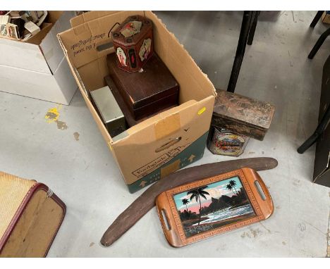 Group of vintage tins, some containing buttons, aboriginal boomerang and Brazilian butterfly wing tray.