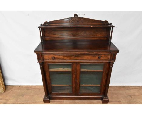 Regency rosewood chiffonier, with arched shelved superstructure and frieze drawer, enclosed below by pair of glazed doors bet