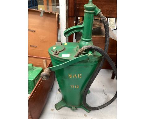 Automobilia including a vintage agricultural oil dispenser, modern jerrycan in the form of traffic lights, vintage brown leat