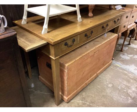 Light oak writing table with three drawers and pull out slides on square taper legs, 125cm wide, 64cm deep, 78.5cm high