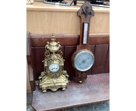 Victorian style mantel clock in ornate cast brass case together with a 1930s barometer and thermometer in carved oak case (2)